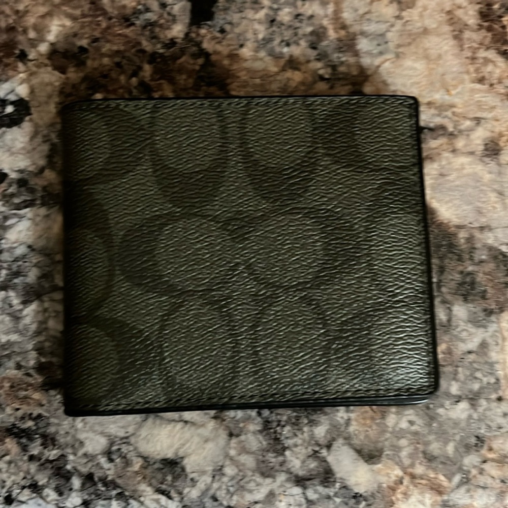 Means two tone coach wallet.